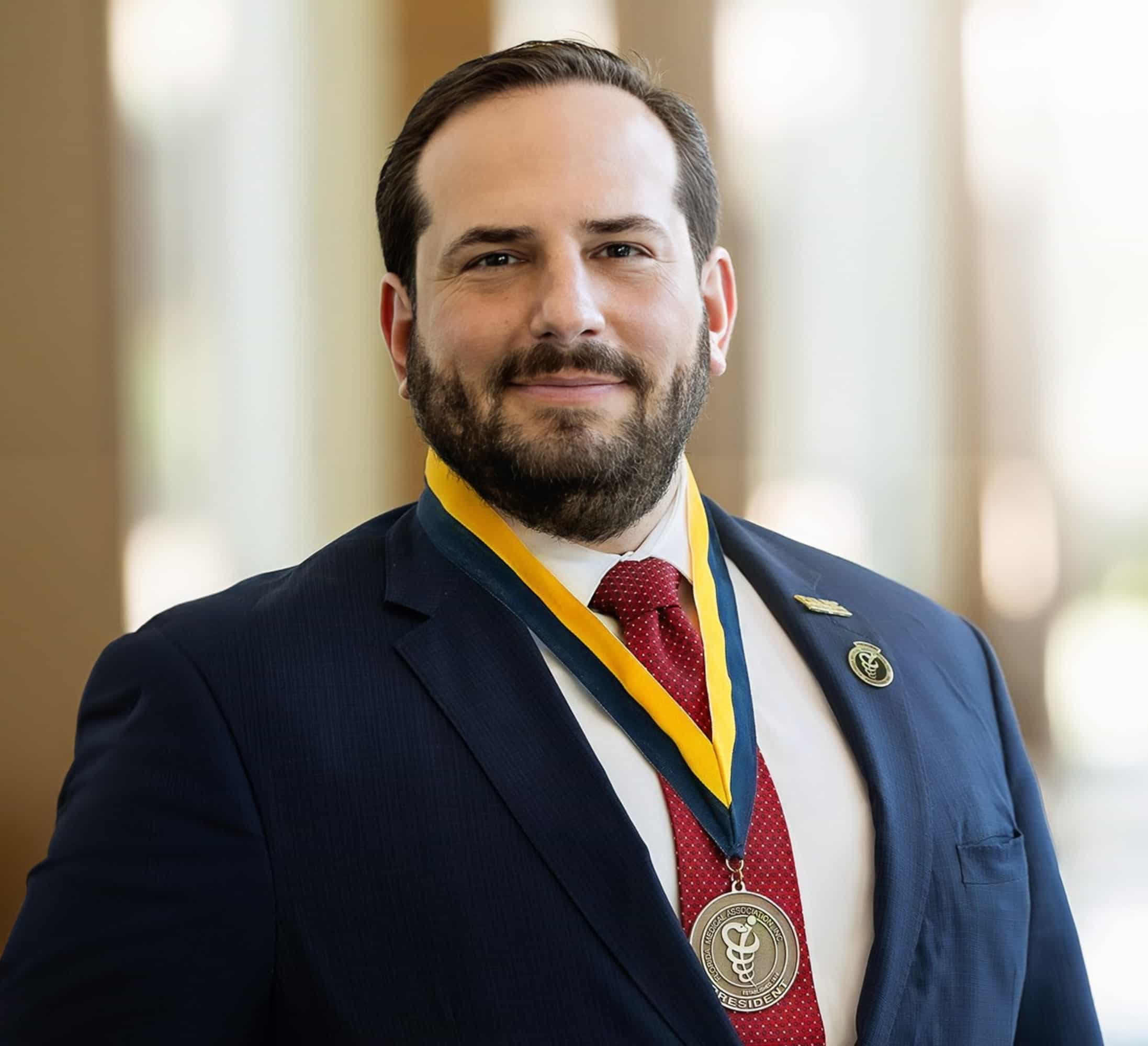Dr. Jason M. Goldman, MD, MACP, wearing the Florida Medical Association presidential medal